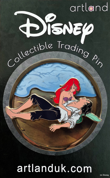 A Disney collectible pin featuring characters Ariel and Prince Eric from The Little Mermaid on the beach, with a transparent background. 