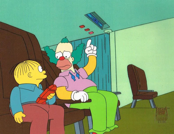 a cel used to create an episode of The Simpsons depicting Krusty the Clown pointing at the ceiling and looking at Ralf Wiggum who is sat next to him. 