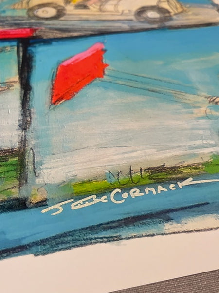 A close up of a Charlie Brown art piece featuring John McCormack's signature. 