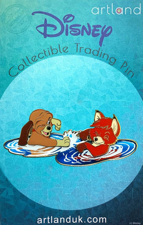 A disney pin inspired by the fox and the hound on a turquoise backing card. this pin includes the fox and the hound playing together in water. the water is transparent.