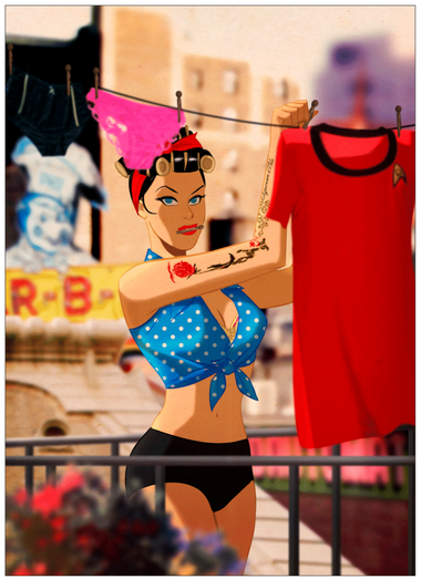 a woman is hanging a star trek t shirt on a washing line. she has her black hair in rollers and a blue polka dot shirt on.